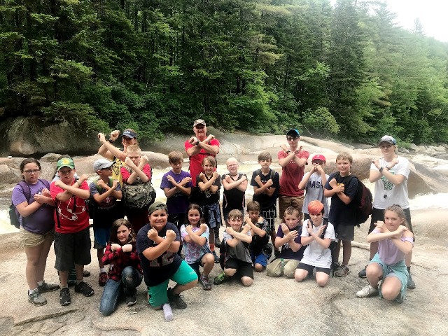 campers near waterfall